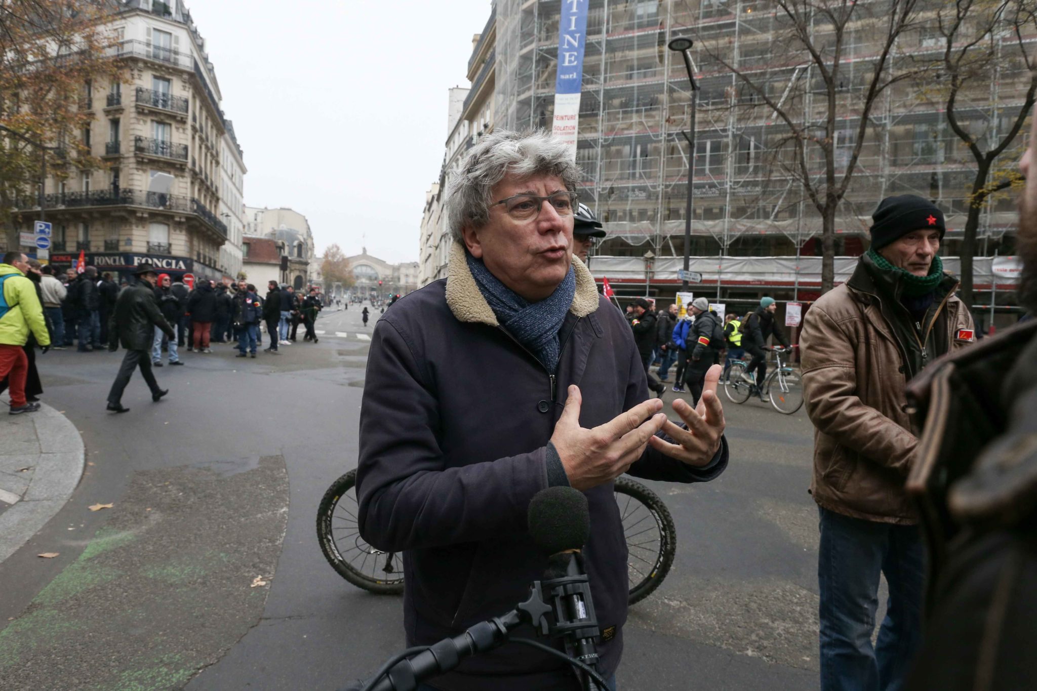 French leftist party La France Insoumise (LFI) deputy Eric Coquerel talks with the press during a demontration to protest against the pension overhauls, in Paris, on December 5, 2019 as part of a national general strike. Trains cancelled, schools closed: F French leftist party La France Insoumise (LFI) deputy Eric Coquerel talks with the press during a demontration to protest against the pension overhauls, in Paris, on December 5, 2019 as part of a national general strike. Trains cancelled, schools closed: F