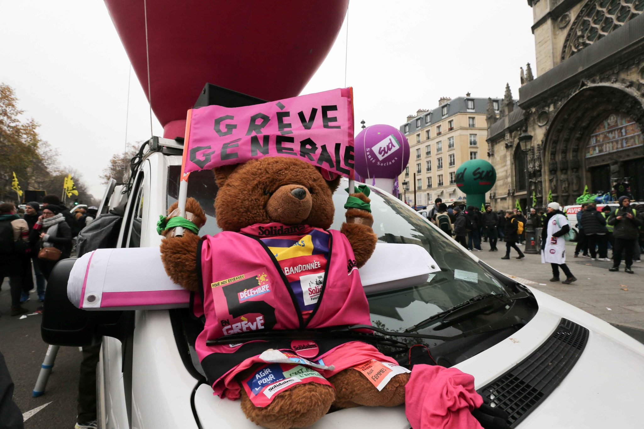 A Teddy Bear bearing the inscription « General strike » is diplayed during a demontration to protest against the pension overhauls, in Paris, on December 5, 2019 as part of a national general strike. Trains cancelled, schools closed: France scrambled to A Teddy Bear bearing the inscription « General strike » is diplayed during a demontration to protest against the pension overhauls, in Paris, on December 5, 2019 as part of a national general strike. Trains cancelled, schools closed: France scrambled to