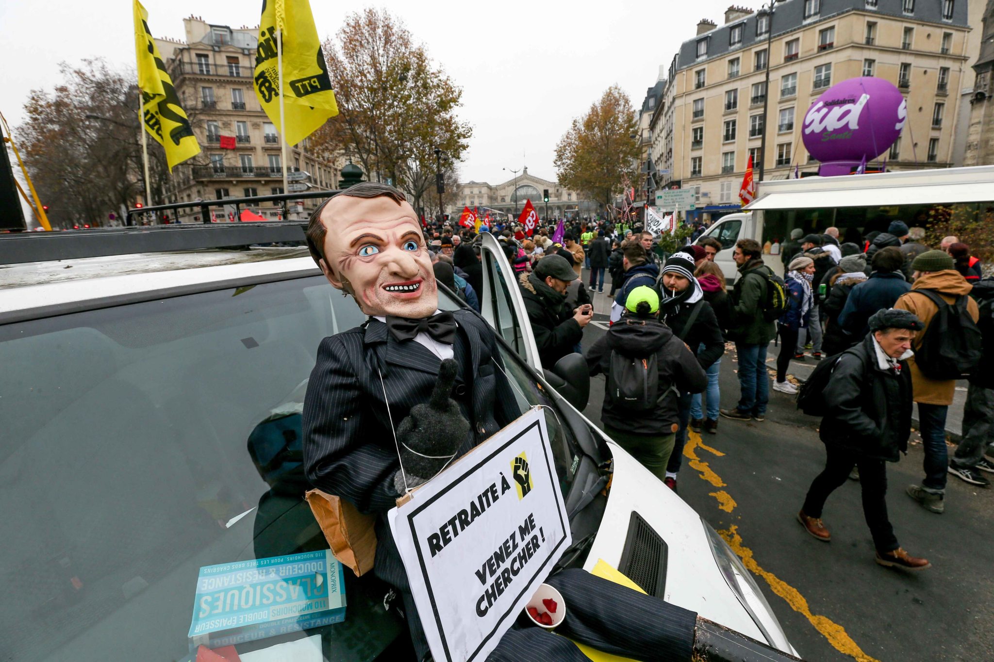 A puppet giving the finger and representing the French President Emmanuel Macron wit the inscription « Come get me » is diplayed during a demontration to protest against the pension overhauls, in Paris, on December 5, 2019 as part of a national general s A puppet giving the finger and representing the French President Emmanuel Macron wit the inscription « Come get me » is diplayed during a demontration to protest against the pension overhauls, in Paris, on December 5, 2019 as part of a national general s