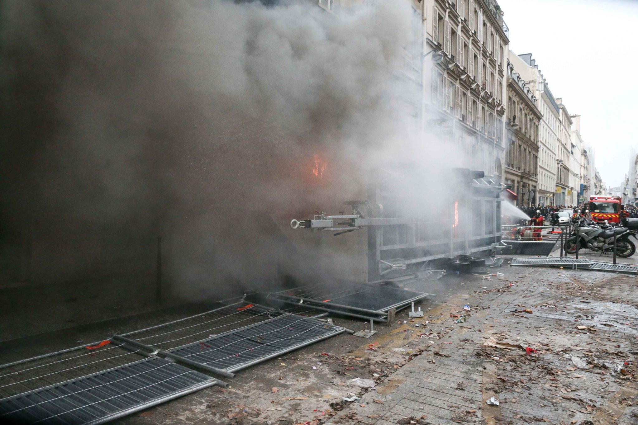 Protesters burn a working vehicle during a demontration to protest against the pension overhauls, in Paris, on December 5, 2019 as part of a national general strike. Trains cancelled, schools closed: France scrambled to make contingency plans on for a huge Protesters burn a working vehicle during a demontration to protest against the pension overhauls, in Paris, on December 5, 2019 as part of a national general strike. Trains cancelled, schools closed: France scrambled to make contingency plans on for a huge