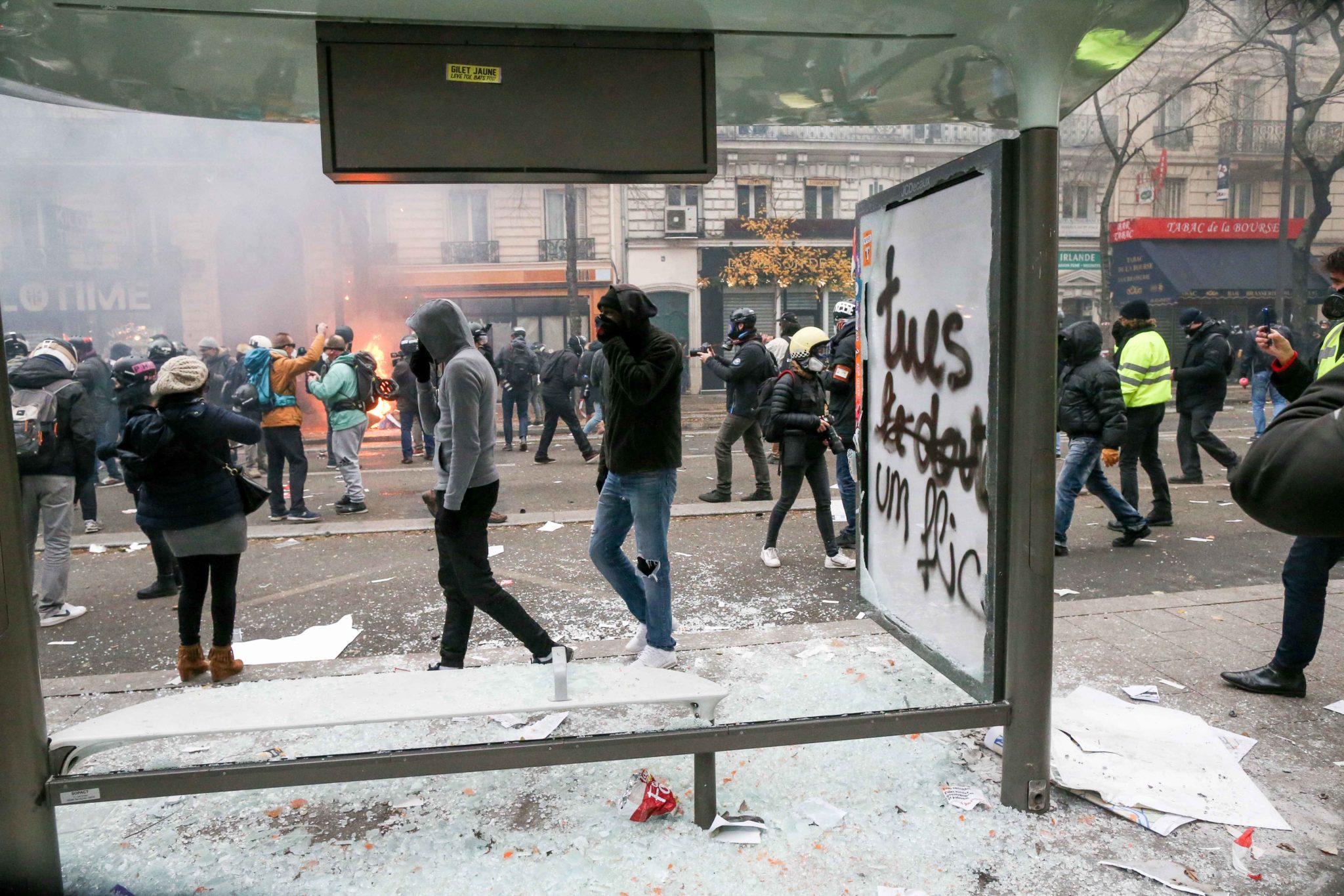 A bus bench is destroyed and tagged with words « Kill a cop » during a demontration to protest against the pension overhauls, in Paris, on December 5, 2019 as part of a national general strike. Trains cancelled, schools closed: France scrambled to make c A bus bench is destroyed and tagged with words « Kill a cop » during a demontration to protest against the pension overhauls, in Paris, on December 5, 2019 as part of a national general strike. Trains cancelled, schools closed: France scrambled to make c